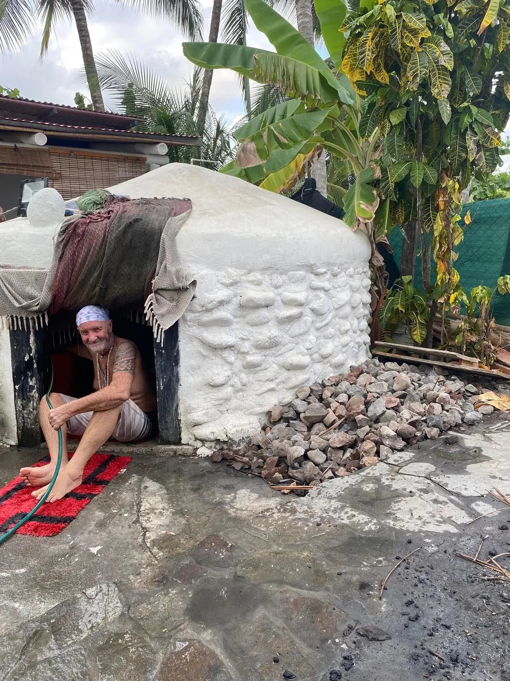 The lodge keeper at the mouth of the temazcal